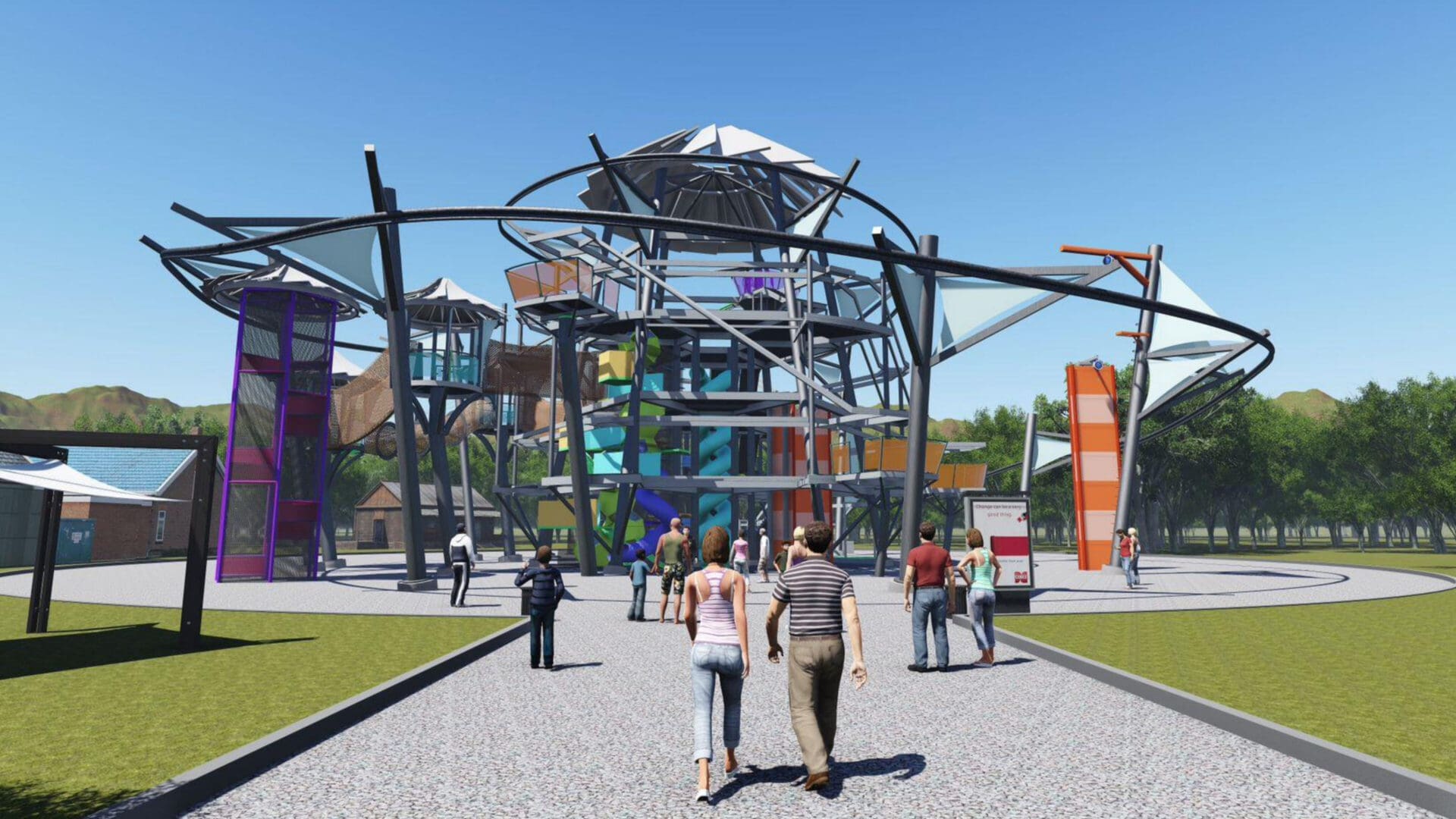 A group of people walking on the sidewalk near an amusement park.